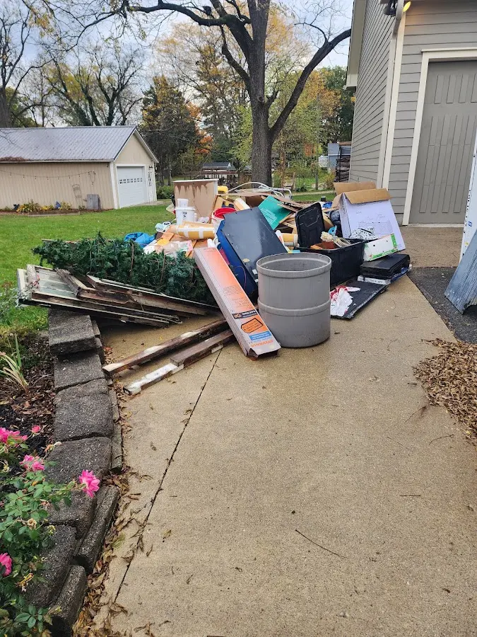 Dumpster being loaded with debris for Commercial Dumpster Rental in Groesbeck